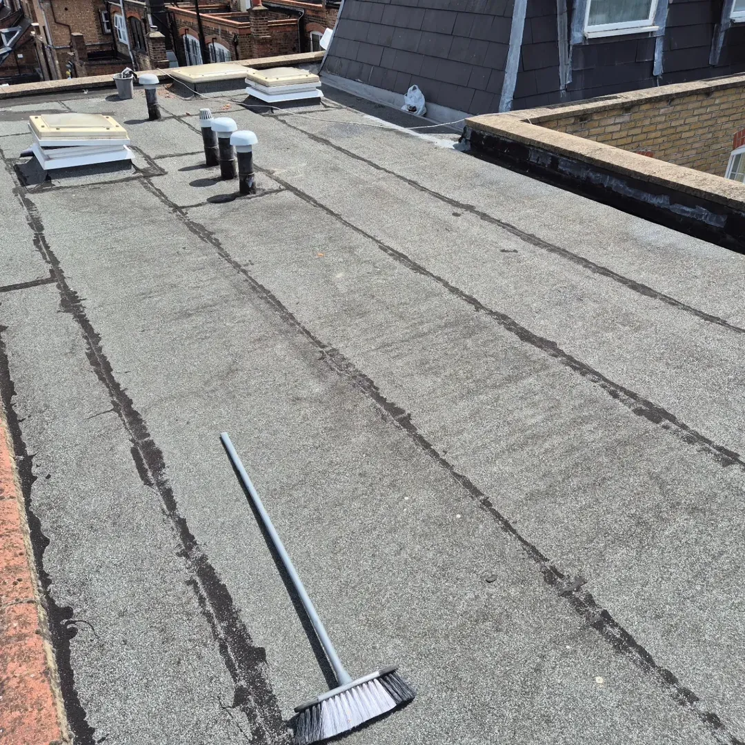A worn felt flat roof before any work