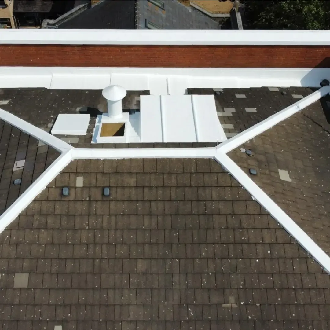 Aerial view of the finished Whitechapel roof, with the parapet copings and details sealed white