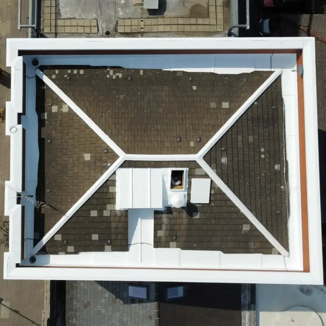 Aerial view of a Whitechapel parapet roof in London E1 with the lead, copings, upstands and ridge details sealed white in the HYDRONYLON system